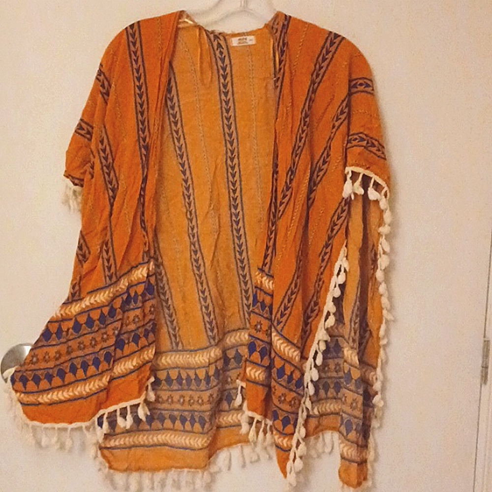 Pretty yellow and blue poncho for women.